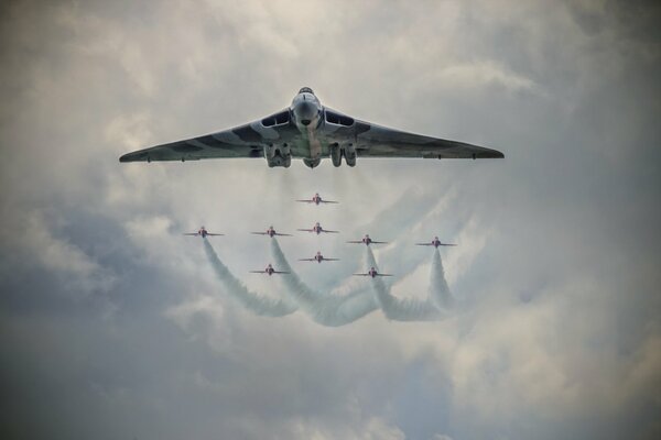 Planes on the background of the sky with smoke