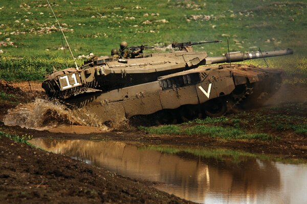 The tank is moving through the mud