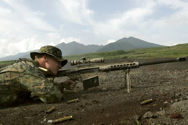 A sniper shoots accurately with a rifle