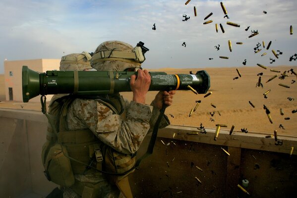 A military man shoots a weapon