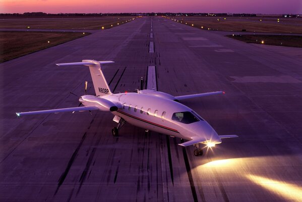 The plane is purple on the runway