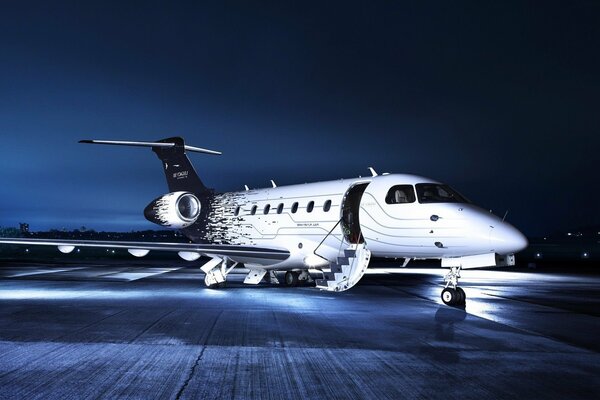 Lights of a private plane at a night airport