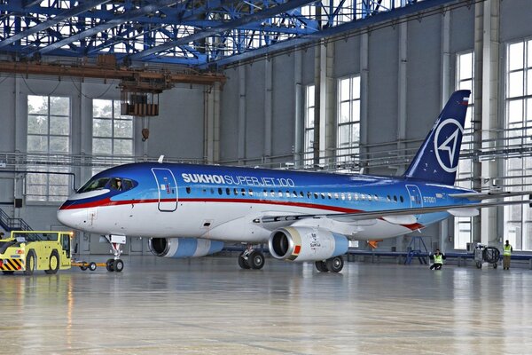 A Russian passenger plane standing in a hangar