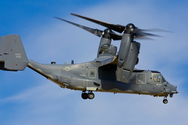 Army tiltrotor on the background of the sky