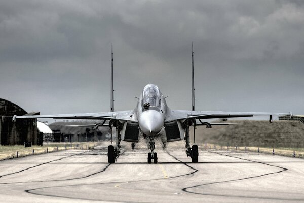 Multi-purpose fighter on the background of the airfield