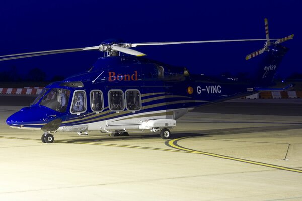 Blue twin-engine AW139 at takeoff.