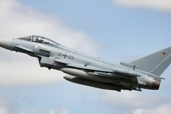 A fighter plane takes off into the sky