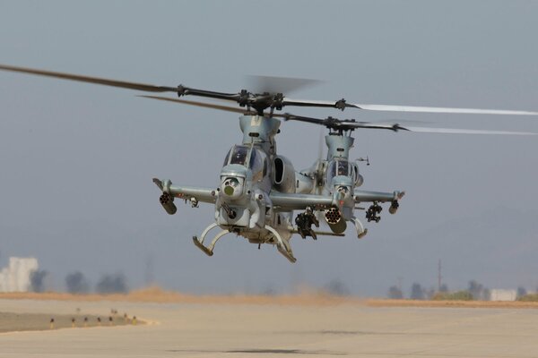 Two helicopters land on the road