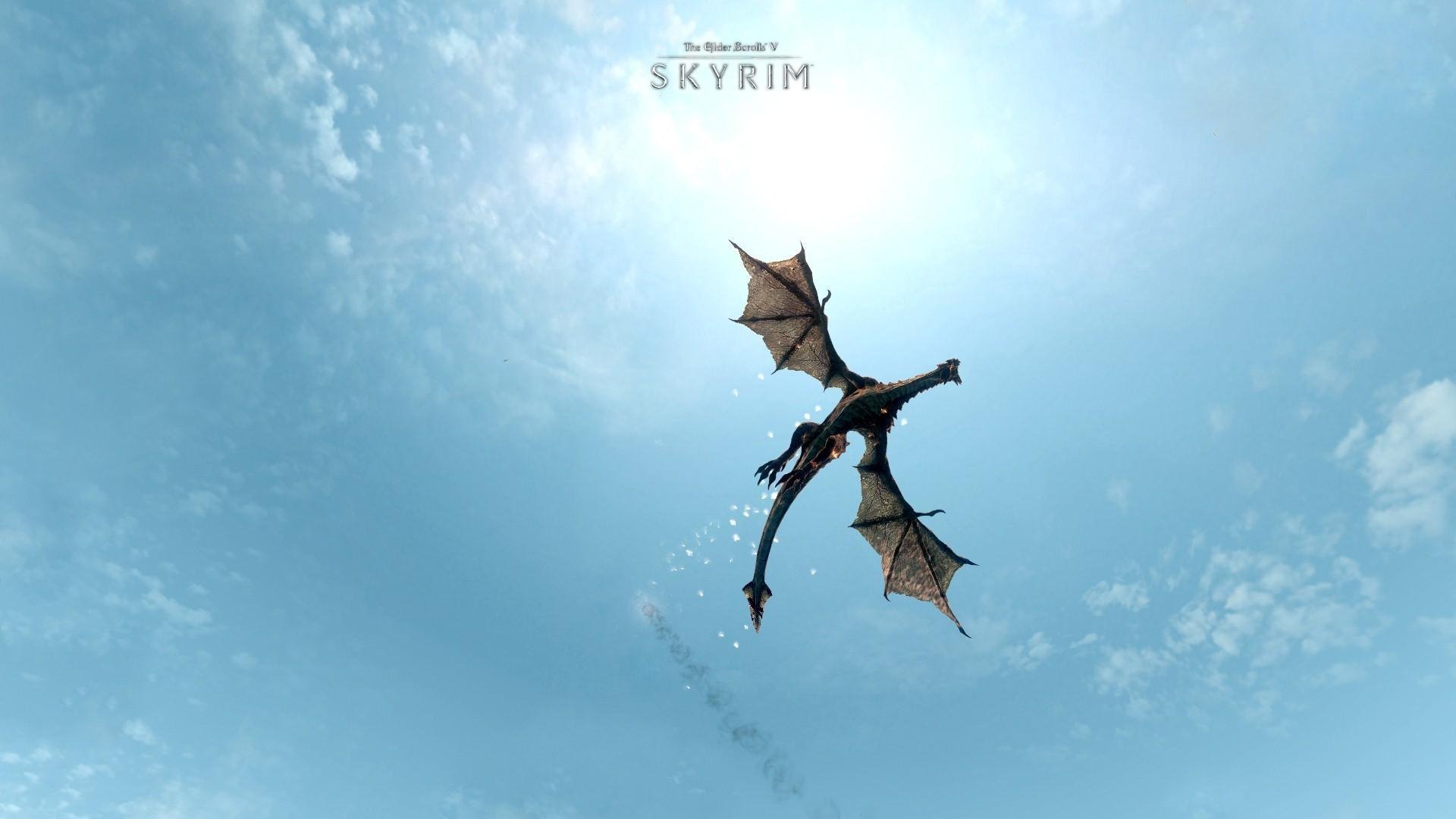 the elder scrolls v: skyrim juego dragón alas cielo azul vuelo