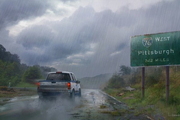 A car on the road under a stormy sky