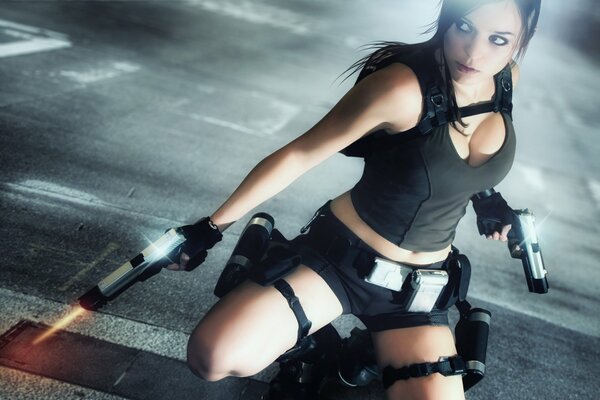 A girl with brown hair in sports open clothes with pistols
