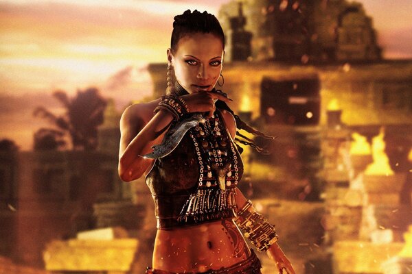 The girl with the dagger looks piercingly at the background of the fire