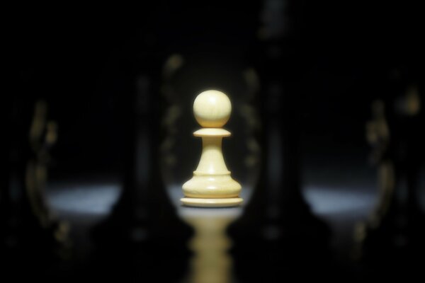 A white pawn surrounded by black enemies