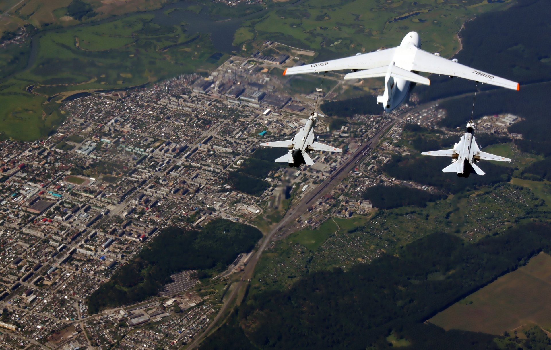 ilyushin il-78 and dry su-24 soviet russia front bomber with variable sweep wing military plane tanker air force refueling sky height the pair town sukhoi russian tactical aircraft petrol