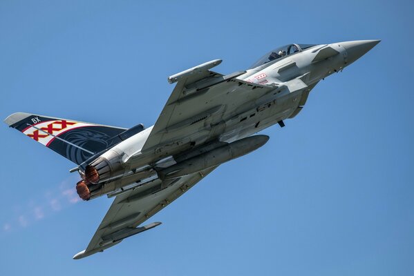 Eurofighter typhoon flies in clear blue sky