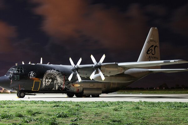 Military transport aircraft with an image of an Indian at the airfield