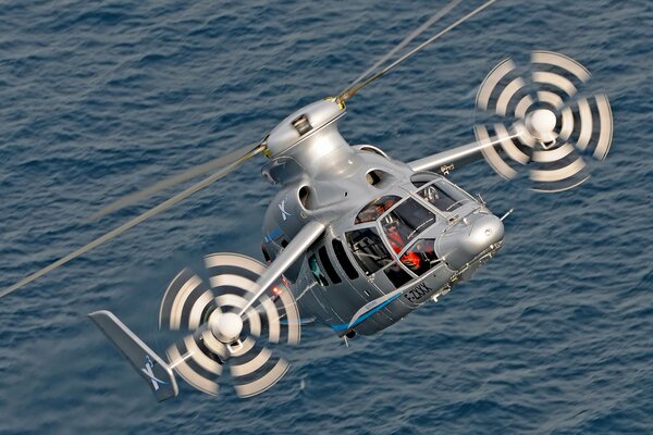 Experimental hybrid Eurocopter x3. Flying over the sea