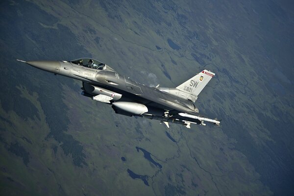 The bomber is flying over the enemy s gorge