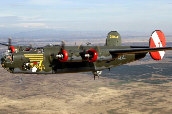 Bomber aircraft flying over the landscape