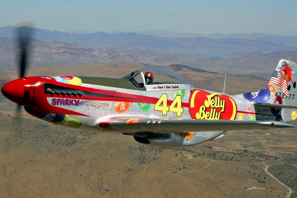 The flight of a fighter plane in the sky near the mountains