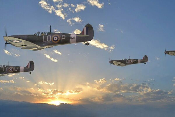 Combattants militaires britanniques dans le ciel au coucher du soleil