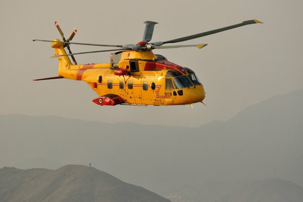 Search and rescue flight of the yellow CH-149 aircraft