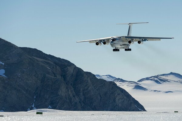 The plane is landing in the mountains