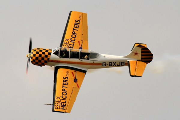 Yellow Soviet training aircraft in the sky