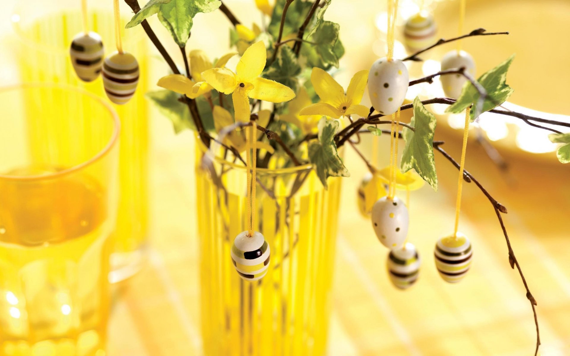 vase branches flower eggs holiday easter yellow background blur