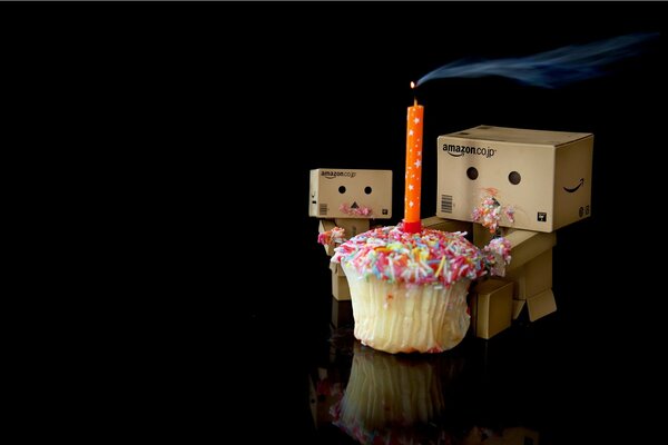 Little men in the form of boxes with a festive cupcake