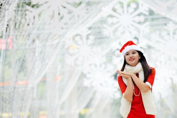 Asian girl in a New Year s costume smiles