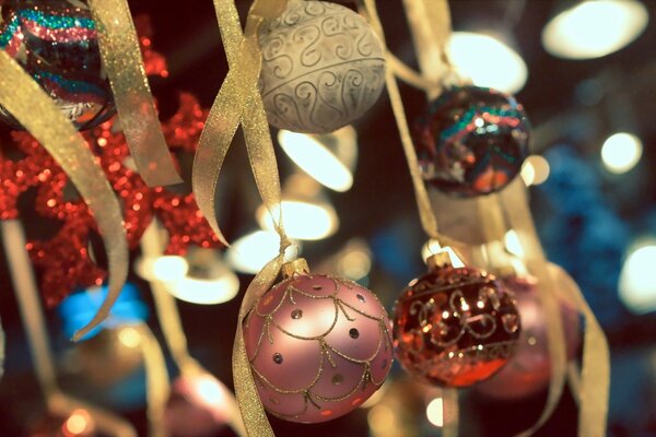 Christmas tree toys on a golden ribbon