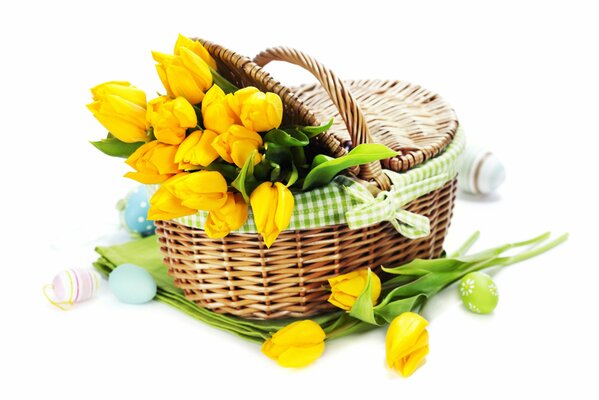 Yellow tulips in a wicker basket