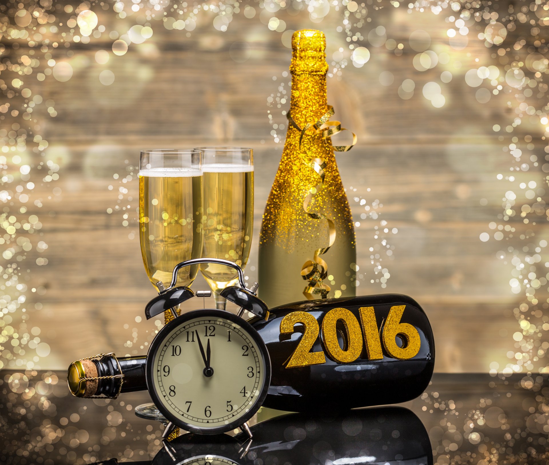 2016 feliz año nuevo oro champán reloj botella copas de vino