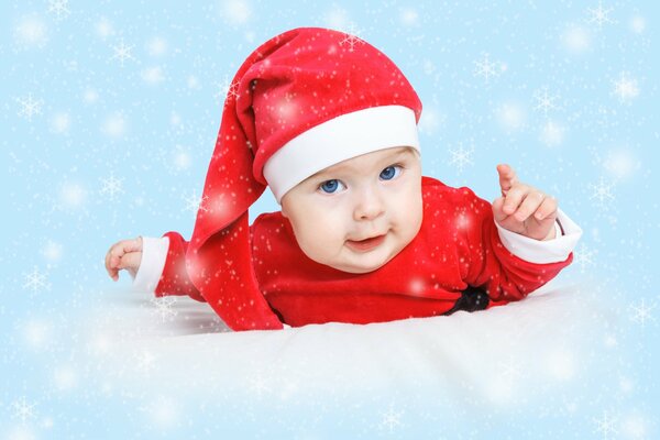 Christmas and New Year: a baby in a Santa Claus hat