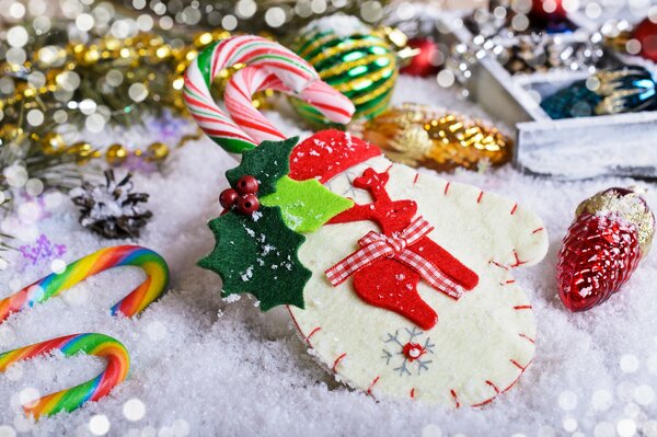 Christmas tree decoration mitten with Christmas lollipops