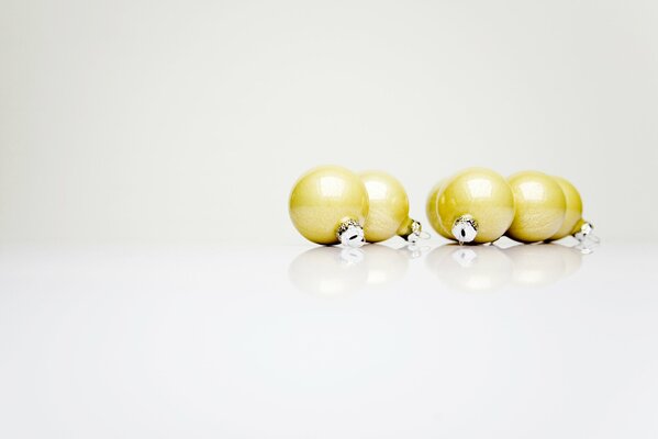 Golden balls on a white background