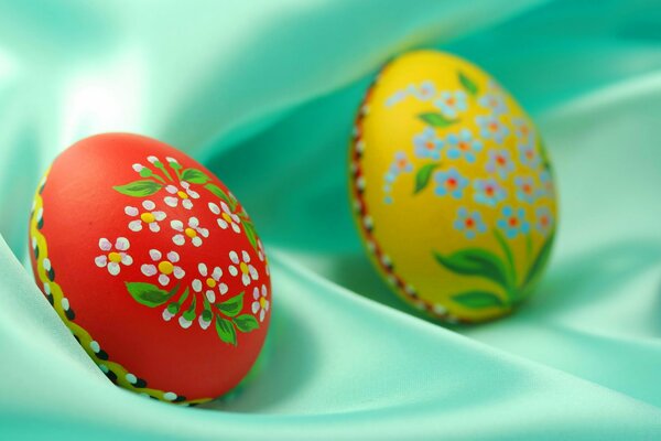 Painted Easter eggs lie on the tablecloth