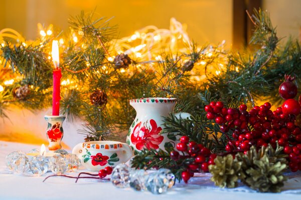 Christmas decoration with berries and candles