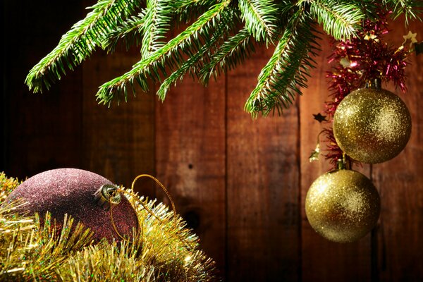 Christmas tree toys on a branch and tinsel