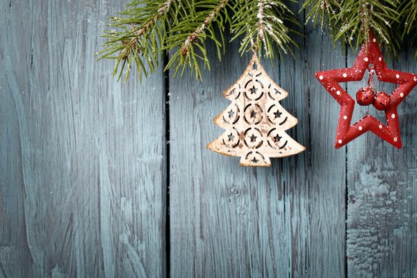 Christmas toys hanging on the Christmas tree branch