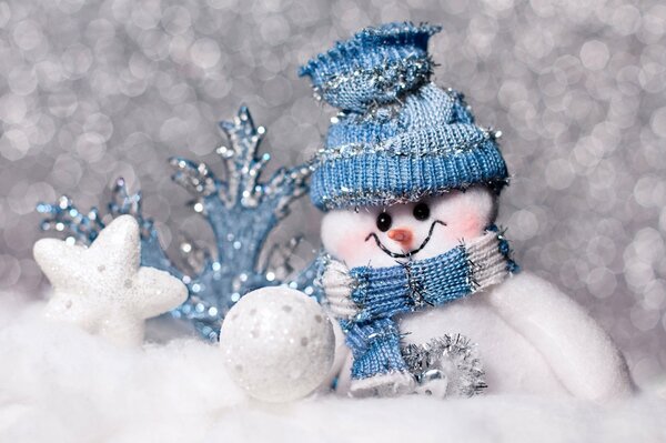 Cute snowman in a blue hat