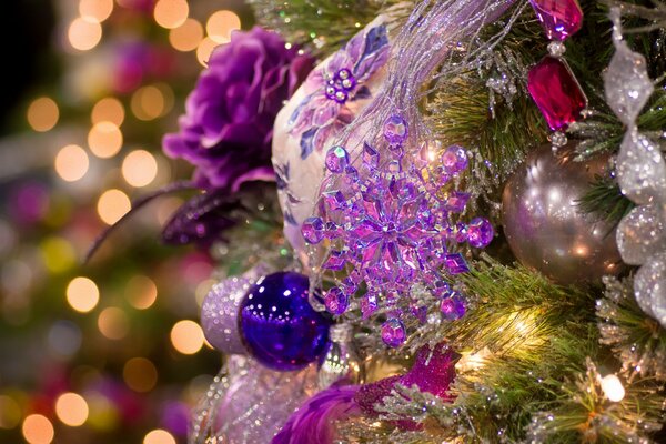 Garlands and lanterns on the Christmas tree branch