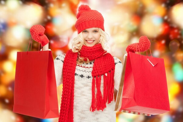 A girl with gift bags after a sale