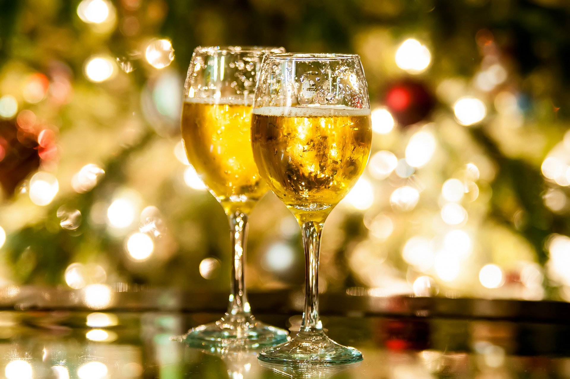 champagne glasses table bokeh lights holiday