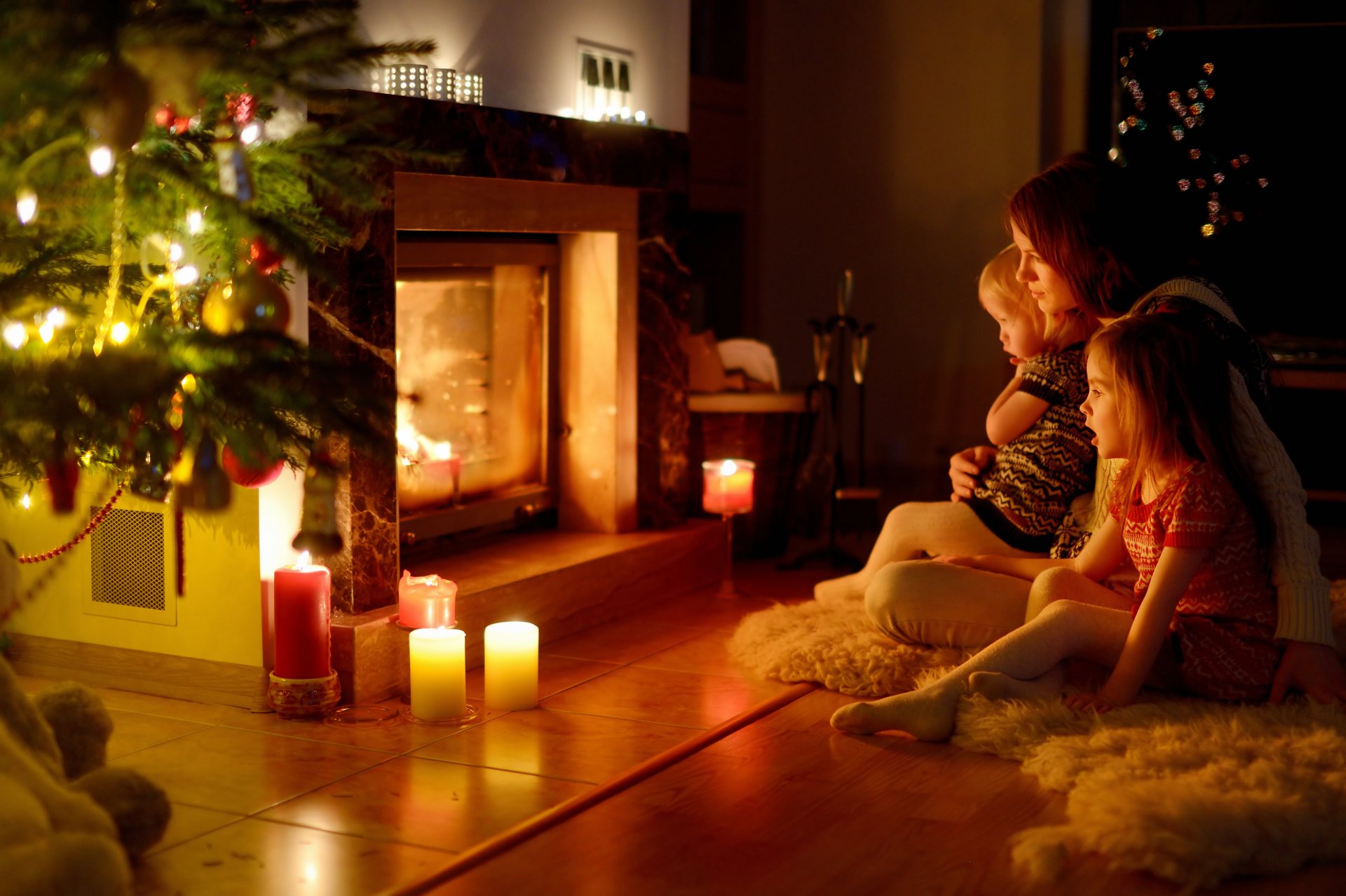 children a woman fireplace christmas family comfort new year