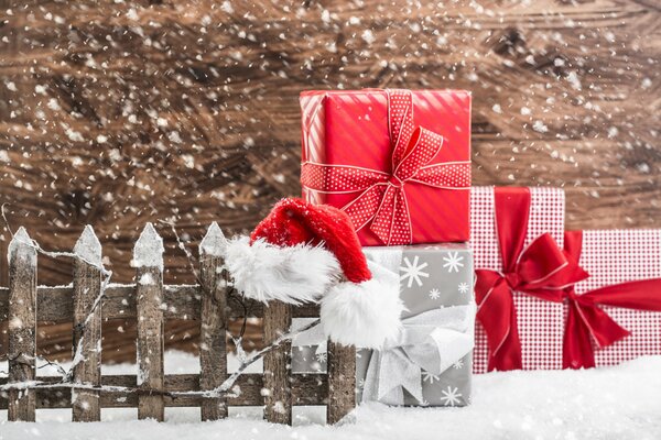 Red gifts in white snow