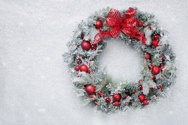 Christmas wreath on white snow