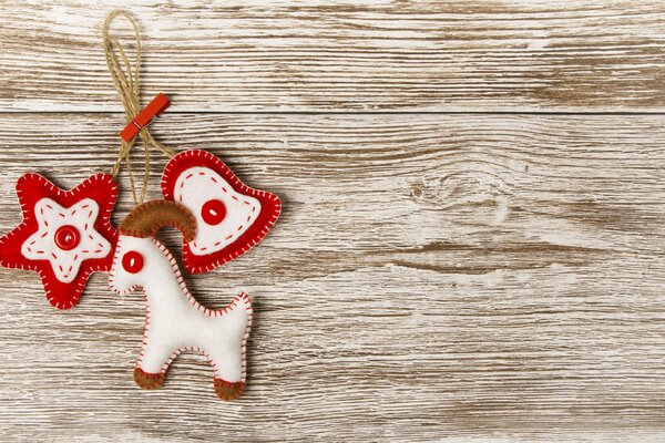 A keychain toy in the form of a goat, a star and a bell