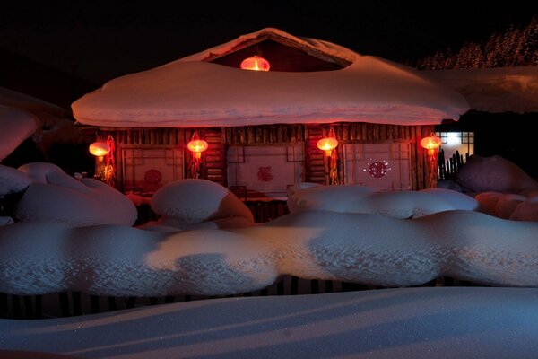 Winter view of the house in the snowdrifts